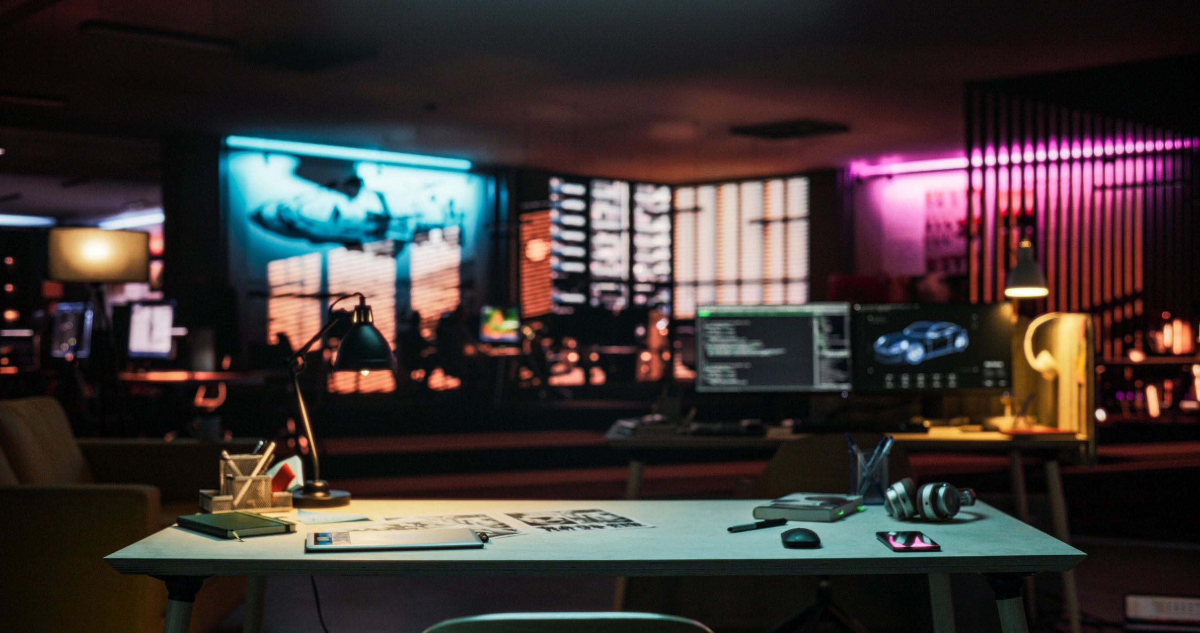 Professional editing workspace with laptop and notebook