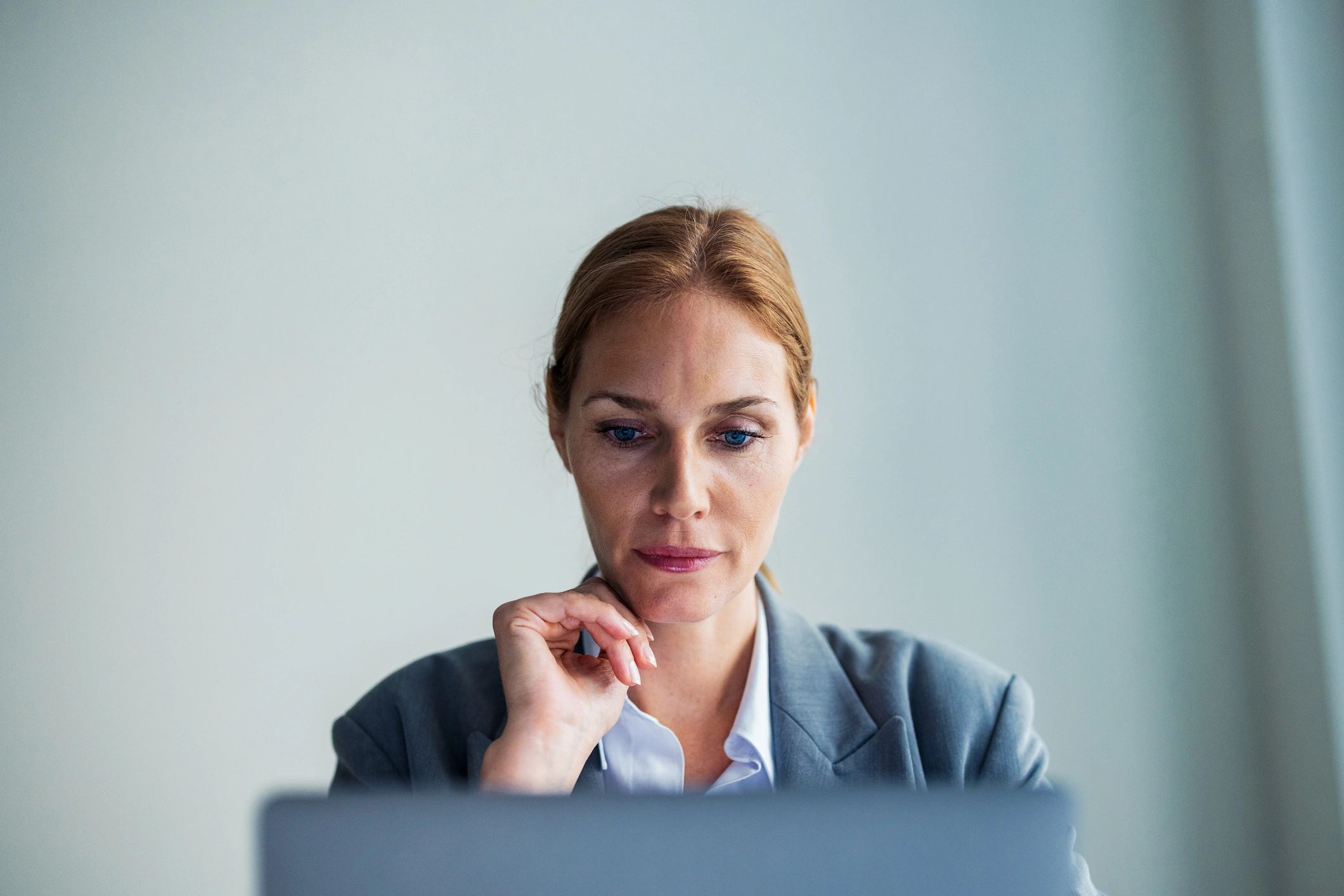 Professional academic writer working at a laptop
